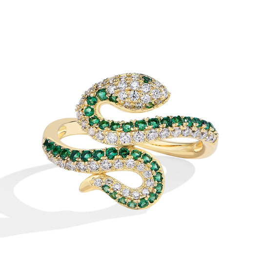 Gold snake-shaped ring with emeralds and diamonds on a white background, featuring the brand 'Charming Light'.