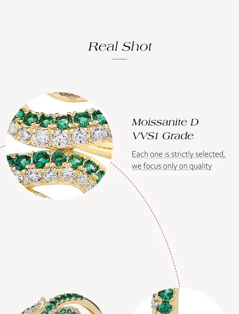 Gold earrings with green gemstones on a white background