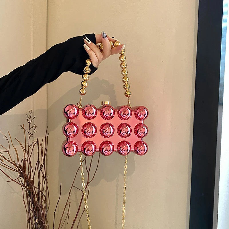 Futuristic clutch with rigid bubble texture