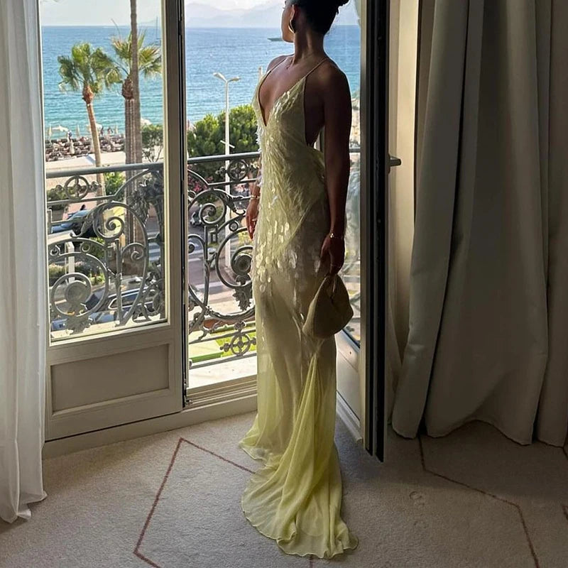 Elegant yellow sheer gown for resort wear