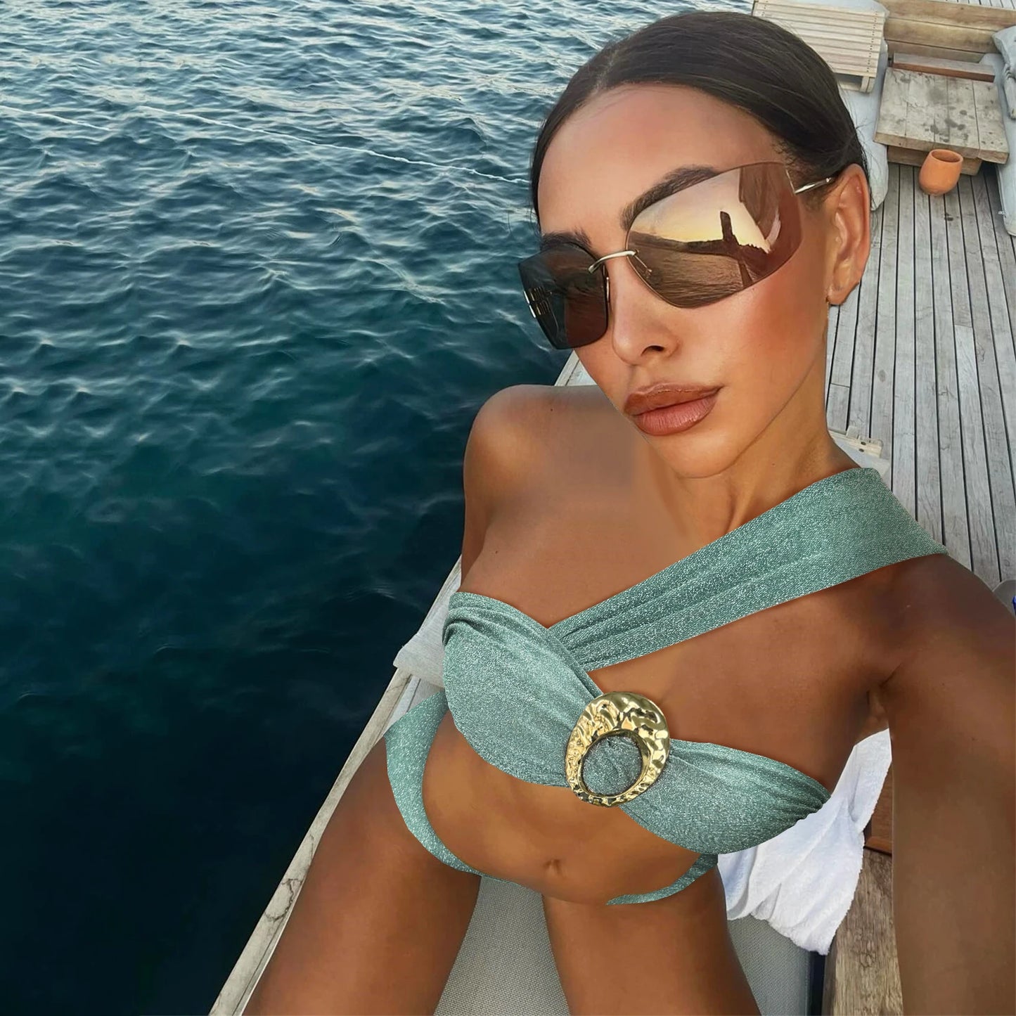 Elegant shimmer bikini with gold oval detail