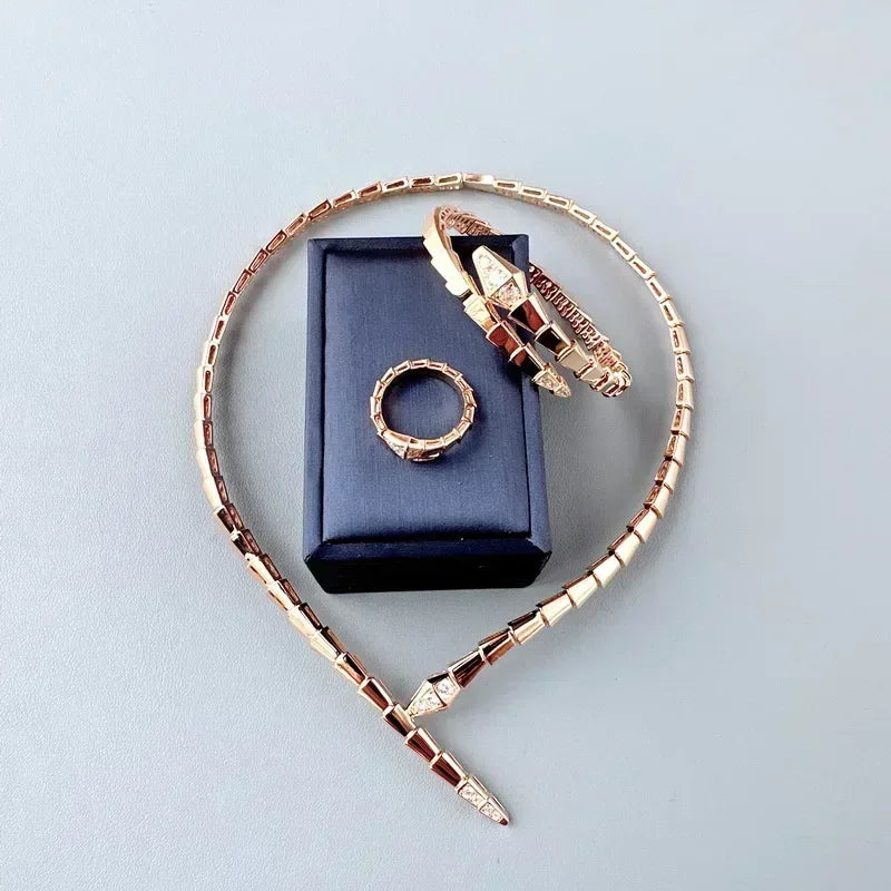 Gold Serpent Jewelry Set with Necklace, Bracelet, and Ring