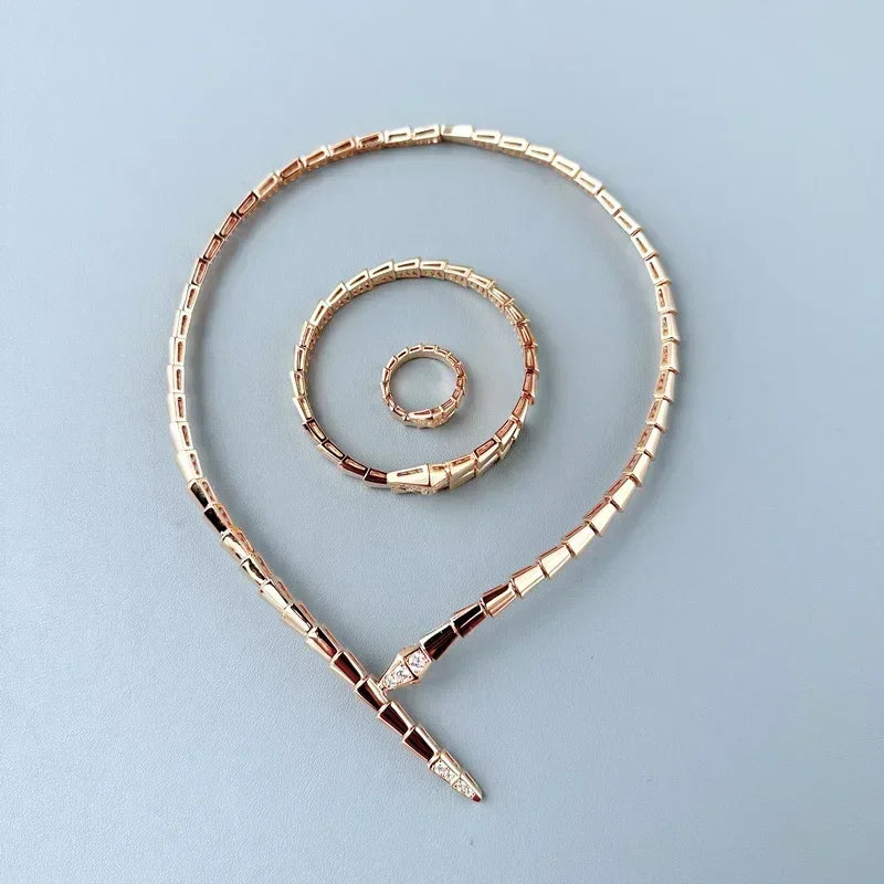 Snake-Inspired Gold Necklace and Bracelet with Crystals