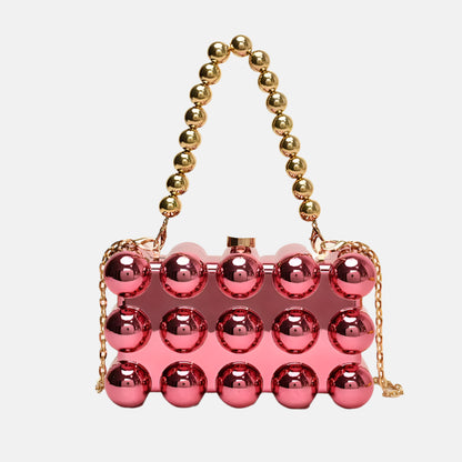 Iridescent orb clutch with gold bead chain